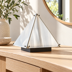 Unlit pyramid desk lamp with translucent panels on an entryway console