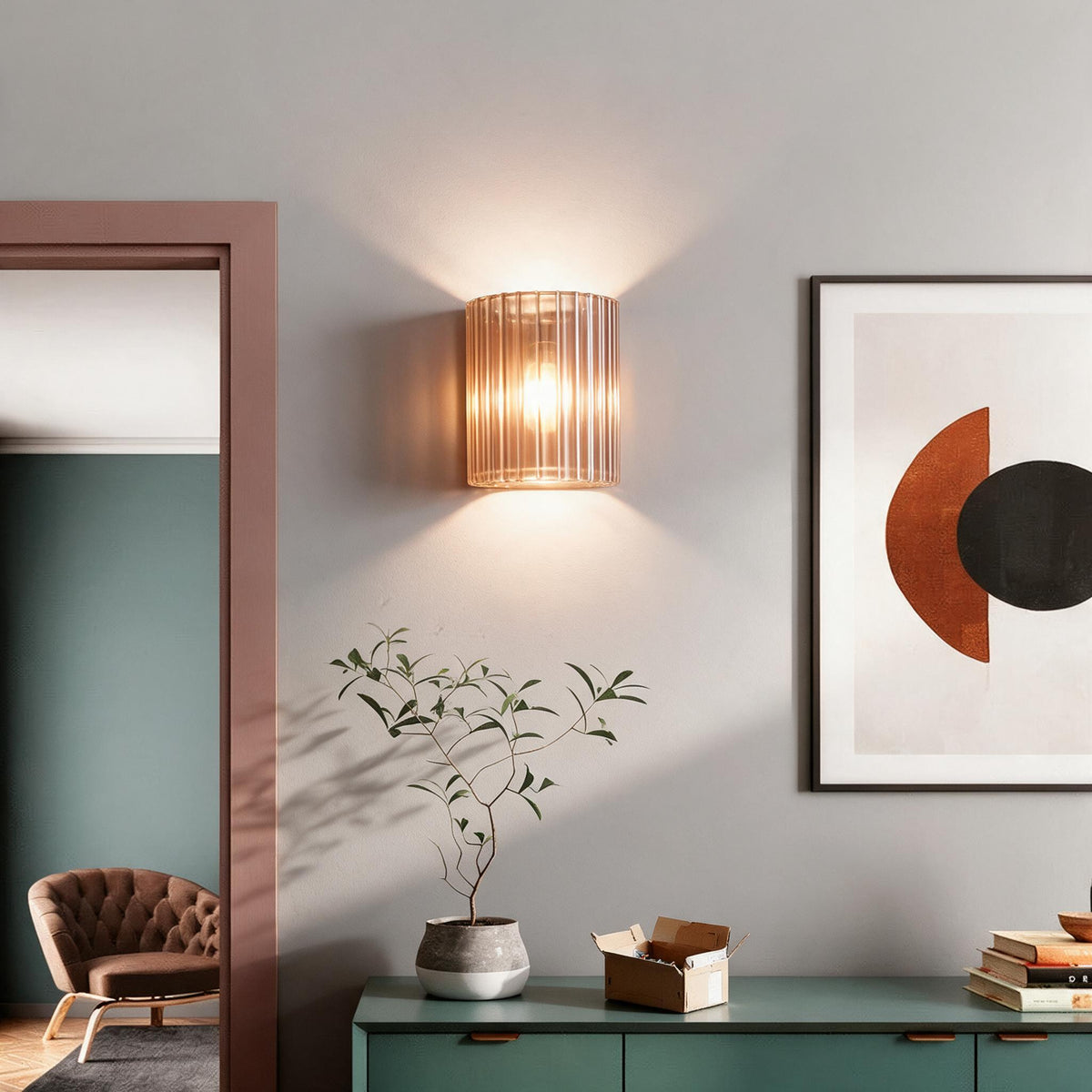 The included G9 LED bulb seated inside the resin wall lamp's fixture.