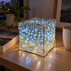 Blue DIY tulip mirror LED night light glowing on a study desk