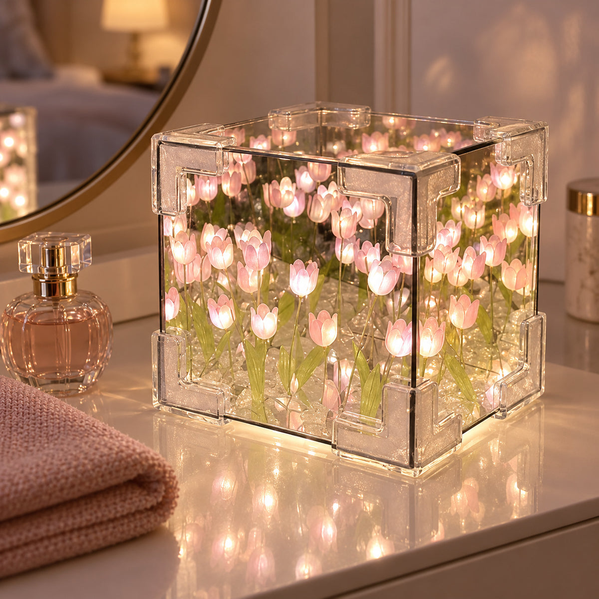 Pink DIY tulip mirror LED night light glowing on a bedroom vanity