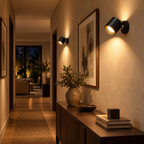 Two black rotating rechargeable LED wall sconces illuminating a hallway