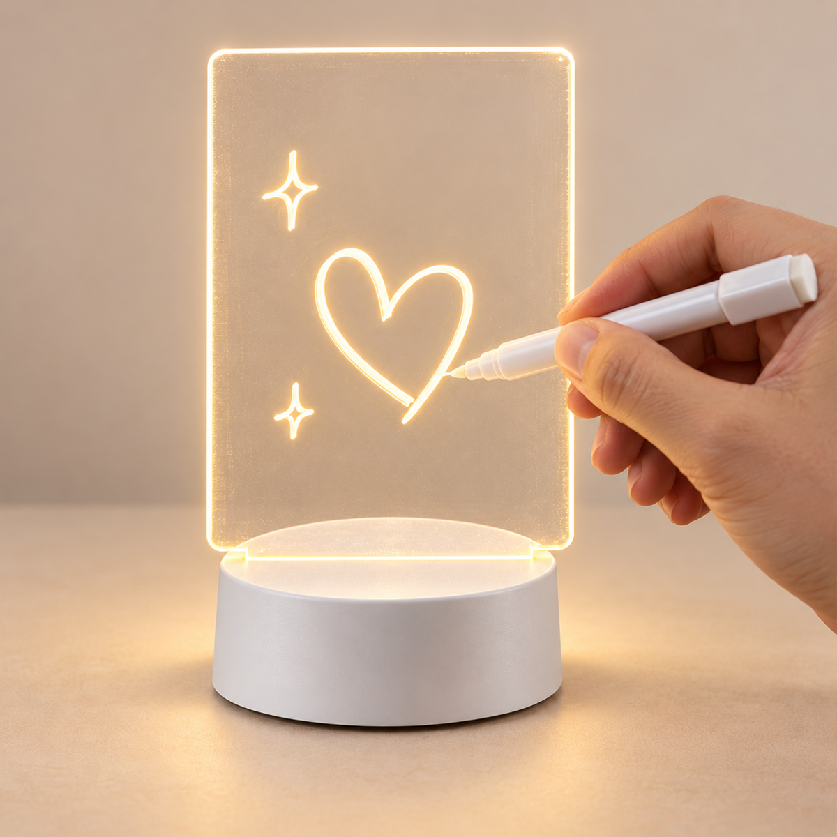Writing a heart on the reusable GlowNote acrylic LED message board