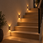 Three light wood motion sensor lights illuminating a staircase