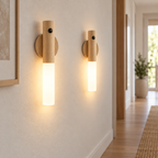 Two Ash wireless USB motion sensor LED lights glowing on a modern hallway wall