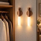 Two Walnut wireless USB motion sensor LED lights glowing beside a wardrobe